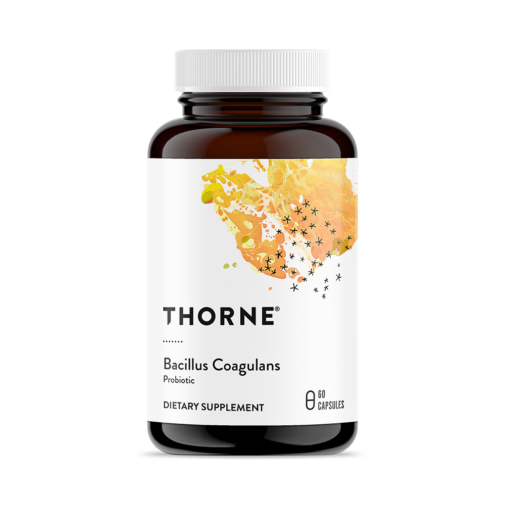 A bottle of Thorne Bacillus Coagulans dietary supplement with 60 capsules. The label is white with a splash of orange color, and the bottle is made of dark glass.