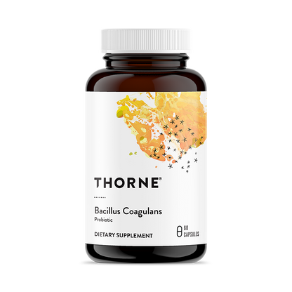 A bottle of Thorne Bacillus Coagulans dietary supplement with 60 capsules. The label is white with a splash of orange color, and the bottle is made of dark glass.