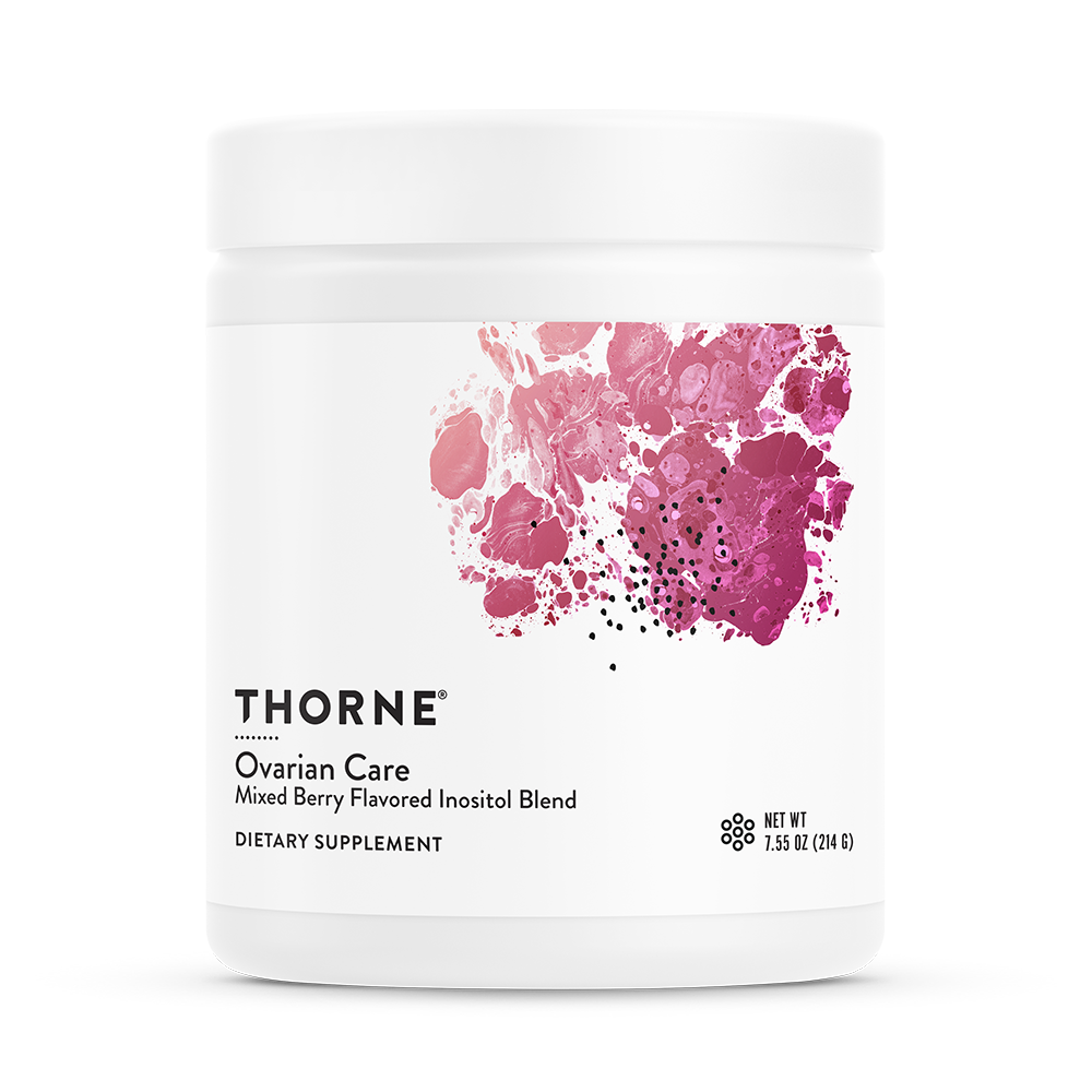 A container of Thorne Ovarian Care dietary supplement with a mixed berry flavored inositol blend. The container is white with a pink and purple abstract design.