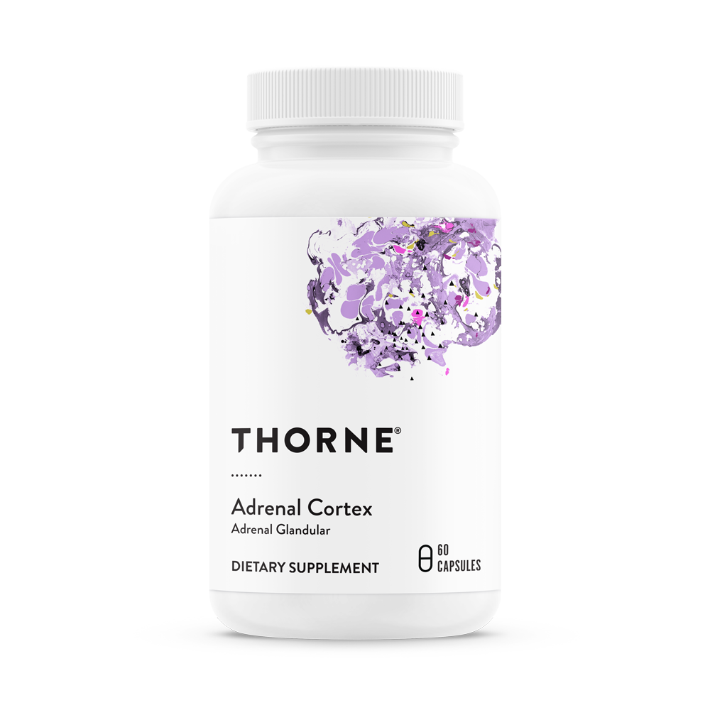 A bottle of Thorne Adrenal Cortex dietary supplement with purple flowers on the label.