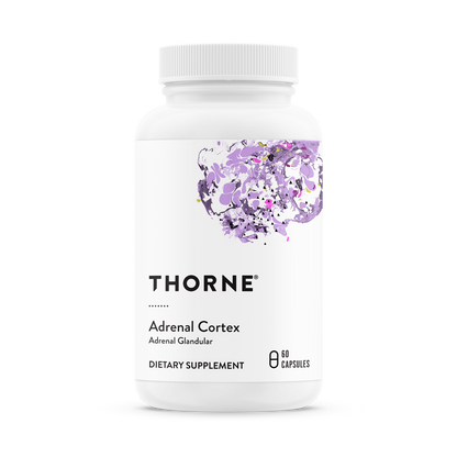 A bottle of Thorne Adrenal Cortex dietary supplement with purple flowers on the label.