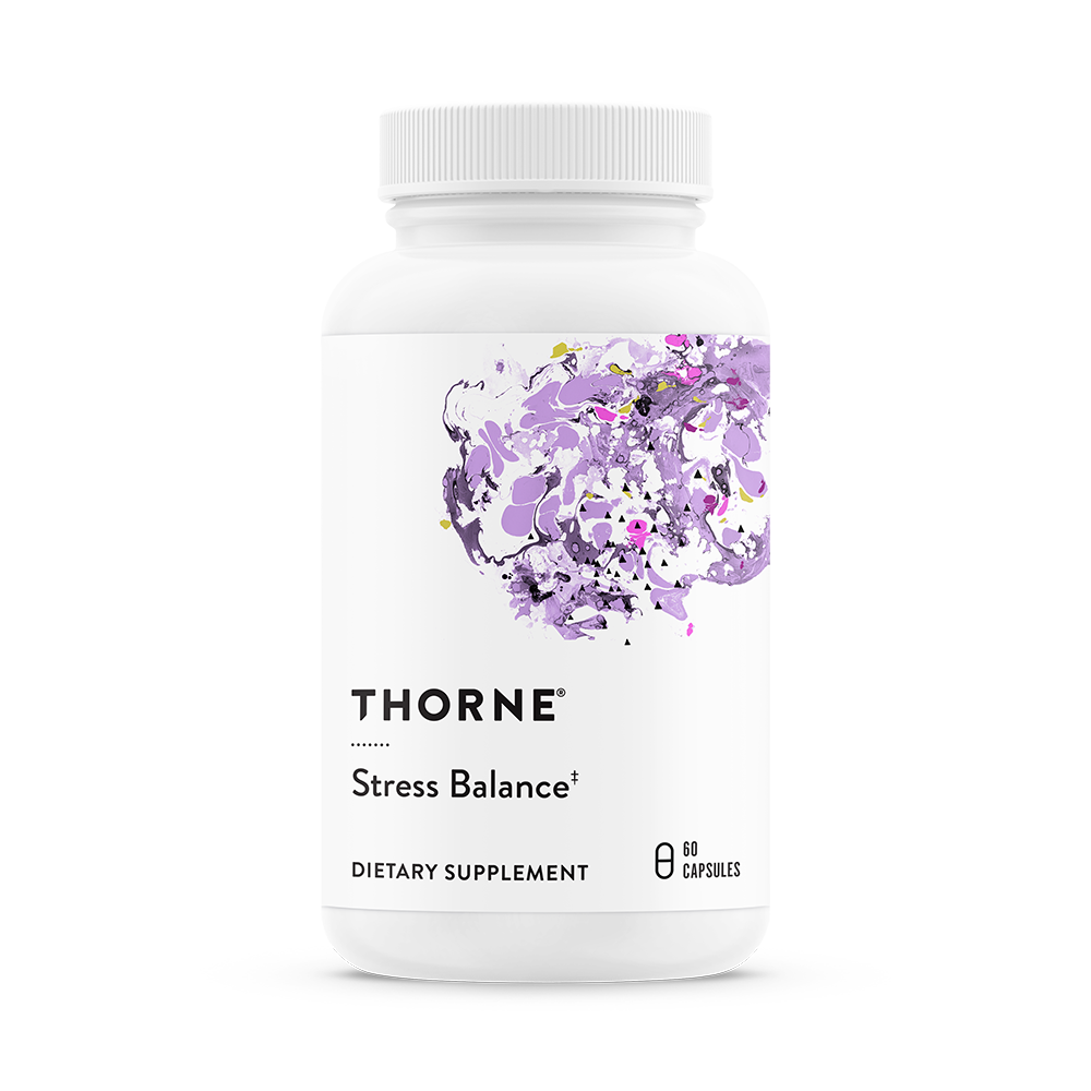 A bottle of Thorne Stress Balance dietary supplement with a purple and white label featuring floral design.