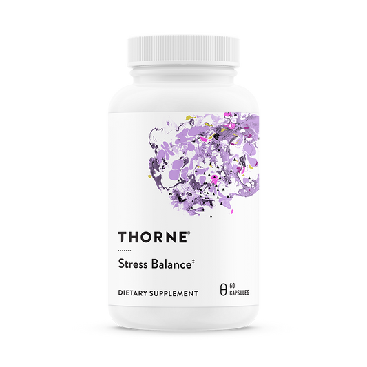A bottle of Thorne Stress Balance dietary supplement with a purple and white label featuring floral design.