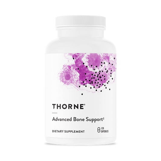 A bottle of Thorne Advanced Bone Support dietary supplement with a white label and purple dots design.