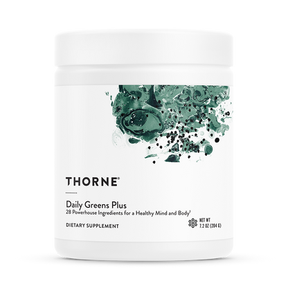 A container of Thorne Daily Greens Plus dietary supplement with a green leaf design on the label.