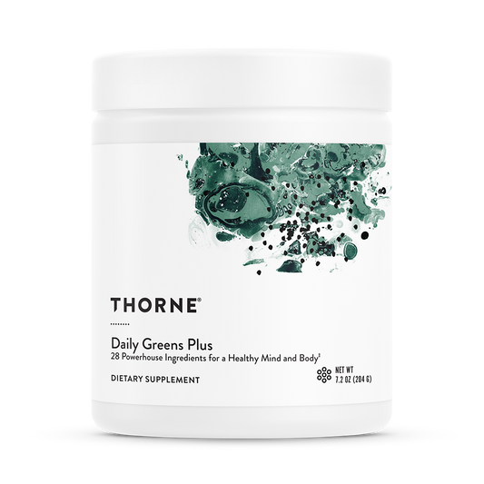 A container of Thorne Daily Greens Plus dietary supplement with a green leaf design on the label.