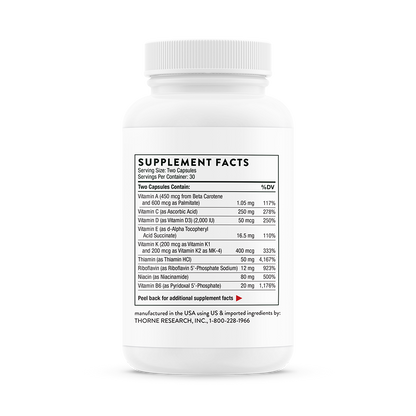 This image displays a bottle of Thorne Basic Nutrients 2/Day - NSF Certified for Sport (VM2), a multi-vitamin and mineral supplement. The white bottle with a label showing the supplement facts highlights the product's dietary benefits.