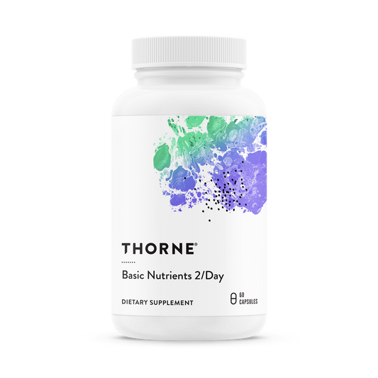 A bottle of Thorne Basic Nutrients 2/Day dietary supplement with a white label and a purple and green watercolor design.