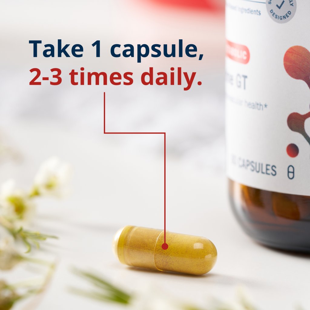 Capsule with text on taking it twice or three times a day, next to a bottle of capsules.